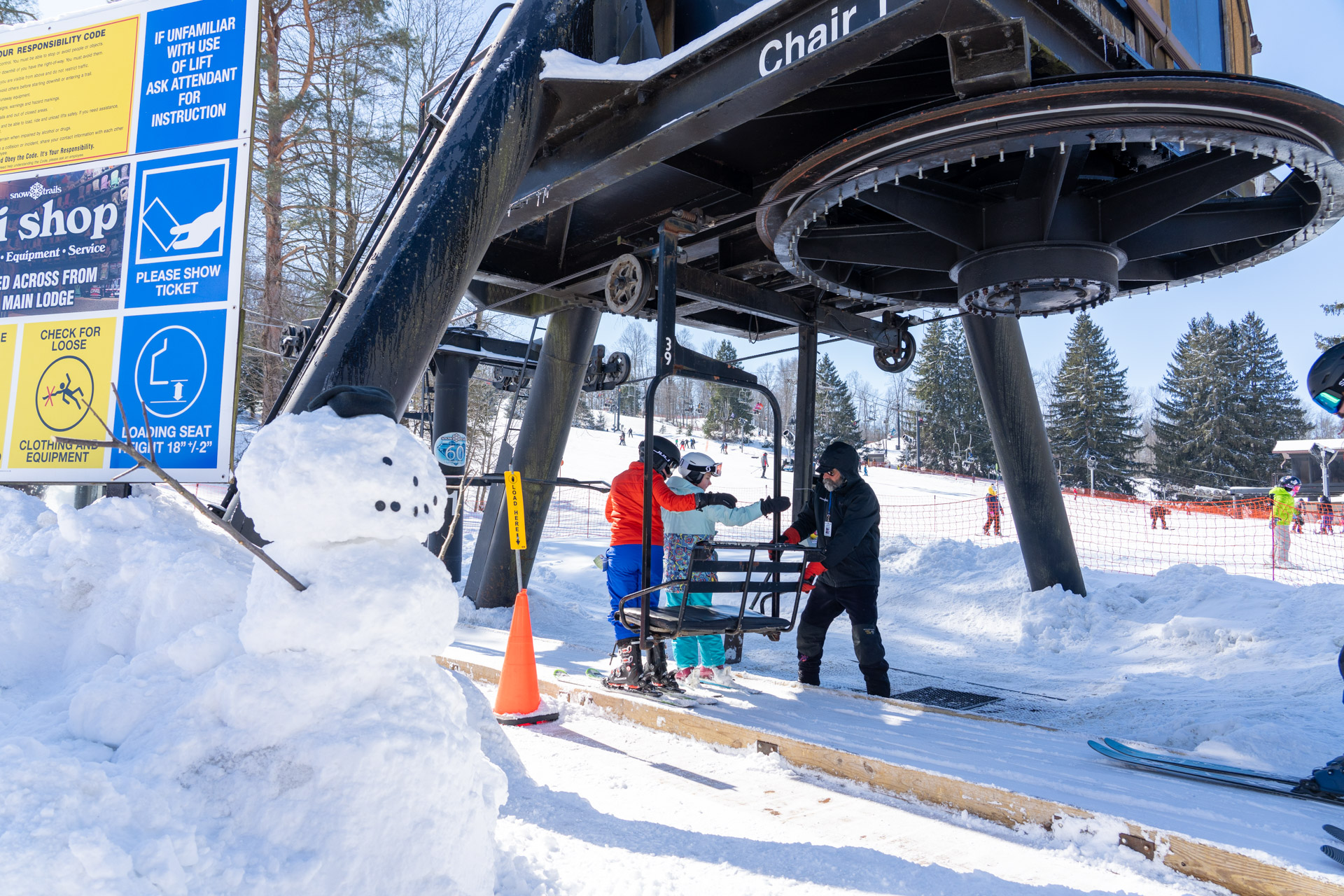 Lift Operator loading skiers - Winter Employment at Snow Trails in Mansfield, Ohio
